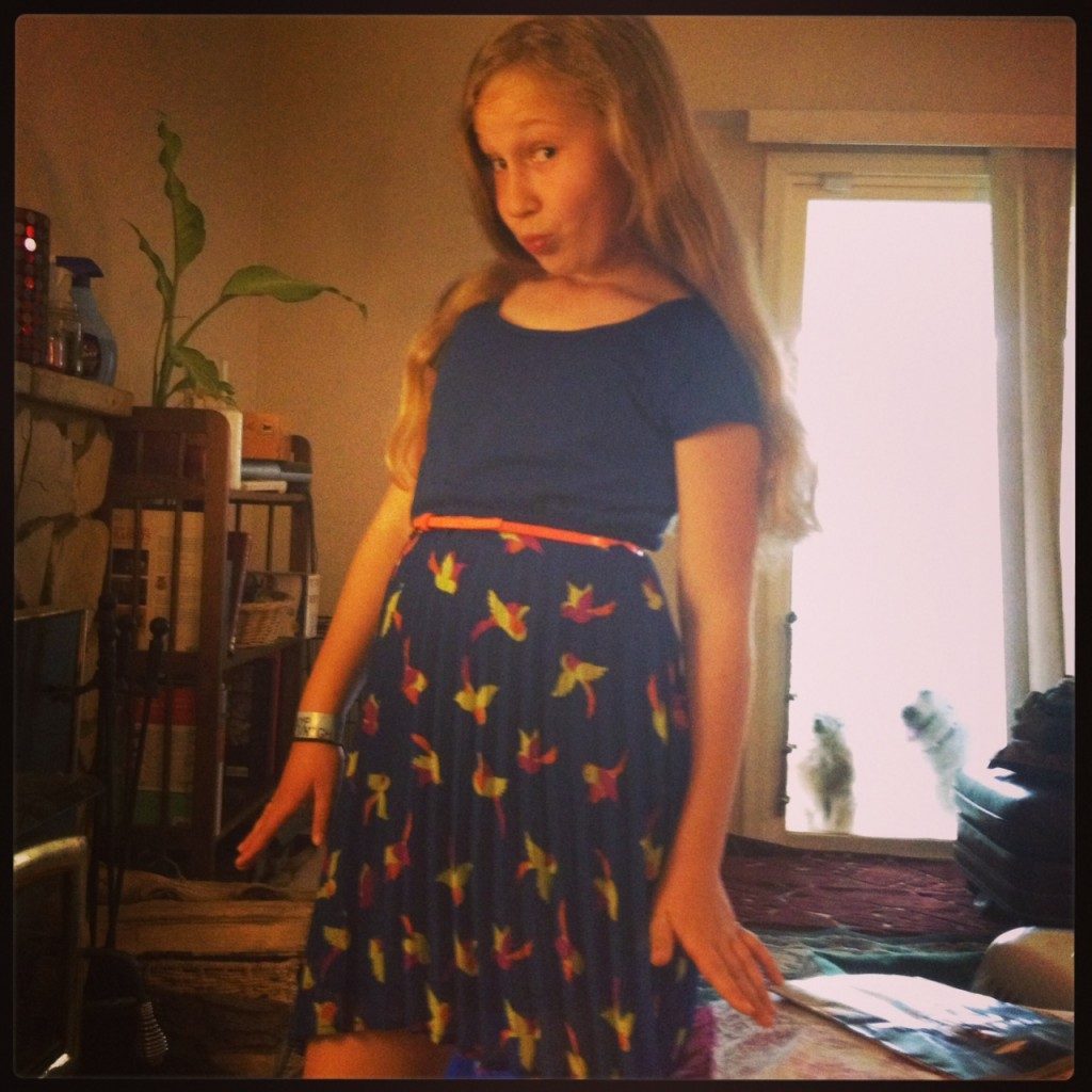 Ava making fun of "duck face" in her new dress